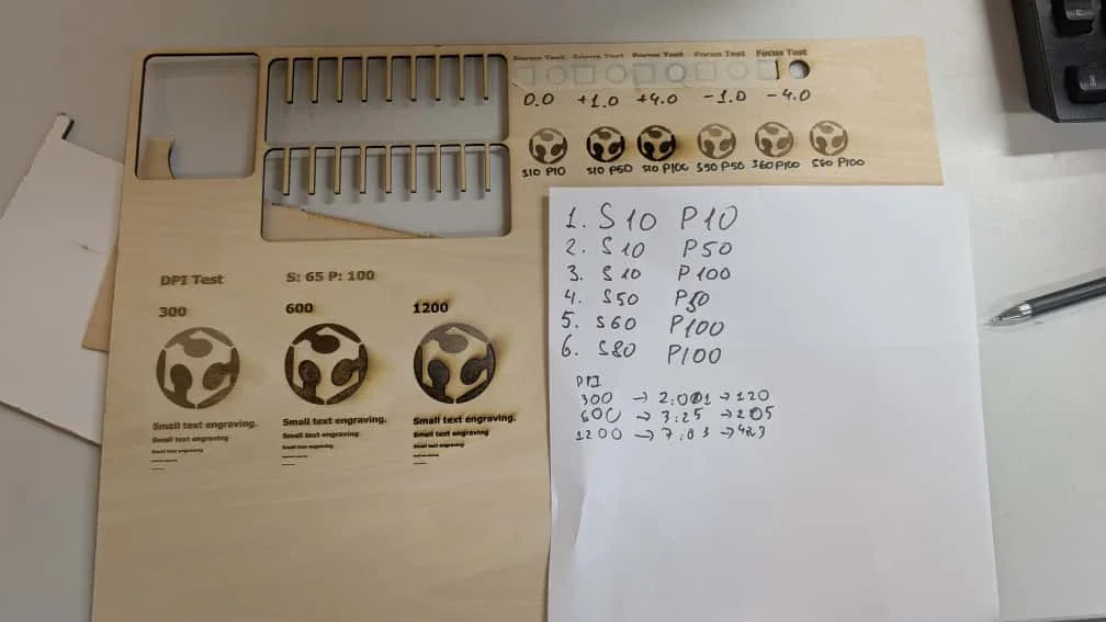 Engraved test board and time summary table comparing 300, 600, and 1200 DPI tests.