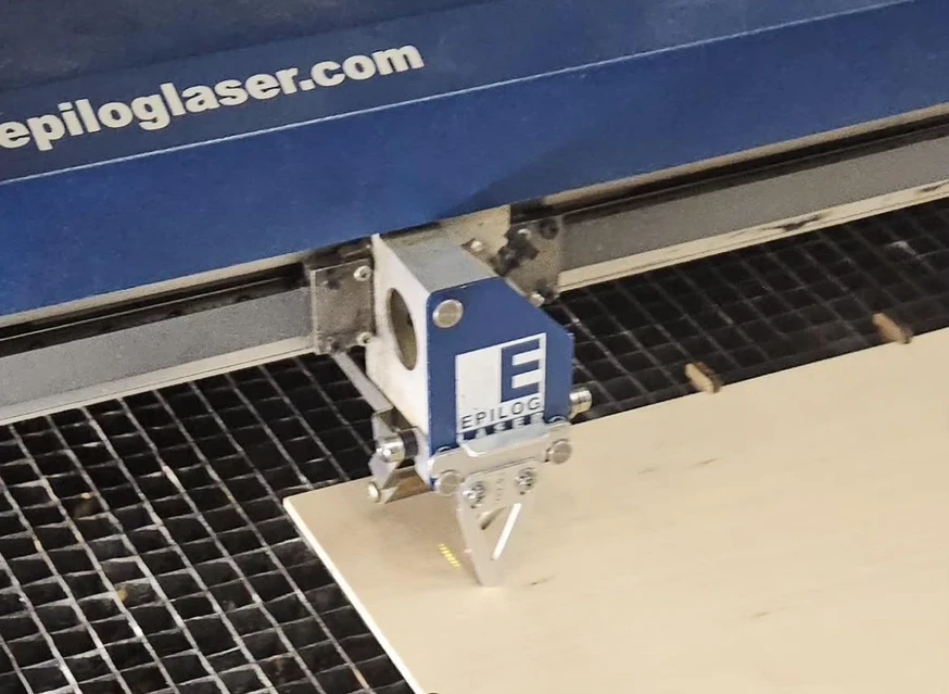Photo of the laser cutter with the manual gauge on